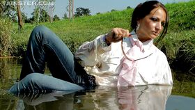 Fully clothed fetish babe in jeans Gina Killmer getting wet outdoor