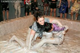 Kinky fully clothed european gals are into messy mud wrestling