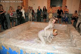 Kinky fully clothed european gals are into messy mud wrestling