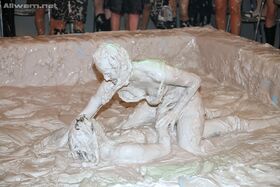 Seductive fully clothed european gals are into messy mud wrestling