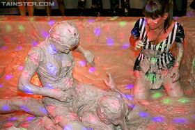 Fully clothed european fetish chicks are into mud wrestling