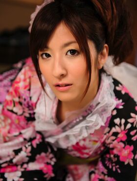 Sweet Japanese geisha looks beautiful for the camera