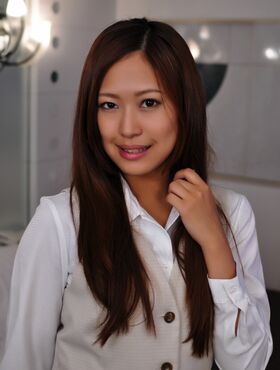 Cute Japanese girl unbuttons her top