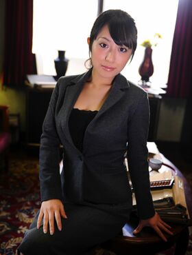 Cute Asian receptionist teases in her uniform