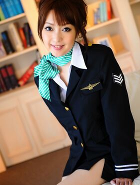 Hot Asian stewardess poses in her uniform