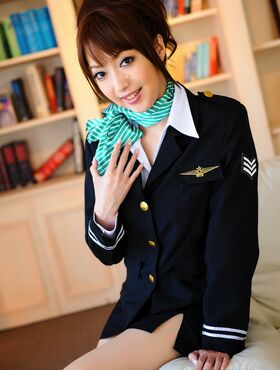 Hot Asian stewardess poses in her uniform