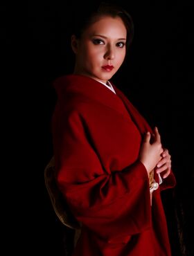 Asian beauty shows off her red kimono
