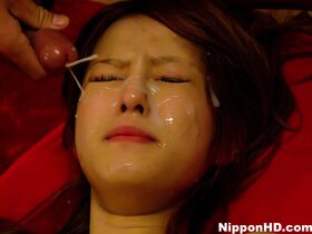 Japanese girl's pretty face gets covered with jizz