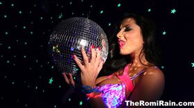 Romi plays with a disco ball