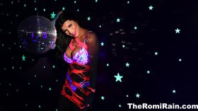 Romi plays with a disco ball