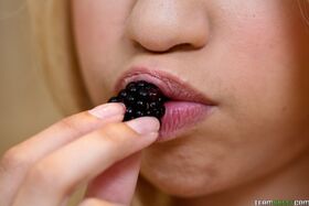 Thin blonde teen Mae Olsen exposing her body while eating sweet strawberries