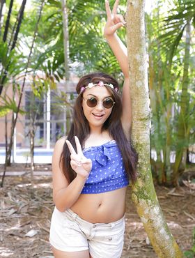 Petite Latina babe Jaye Austin posing fully clothed outdoors in sunglasses