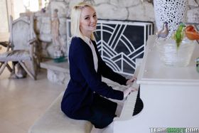 Innocent blonde Sammie Daniels is playing piano during undressing