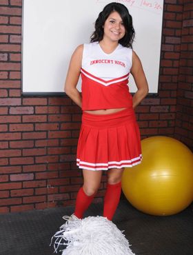 Dark haired cheerleader Christina Moure strips from her uniform