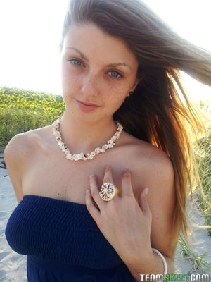 She's New - Elegant blue eyed teen Staci Silverstone flashes shaved pussy upskirt on beach