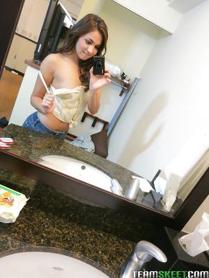 She's New - Sassy brunette stripping in front of the mirror and making selfies
