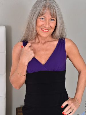 Anilos - Mature lady with silver hair and a flat chest strips to masturbate on her bed