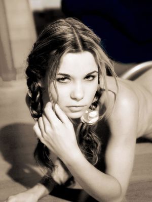 Erotic Beauty - Thin girl with a tempting look to her models naked in braided pigtails
