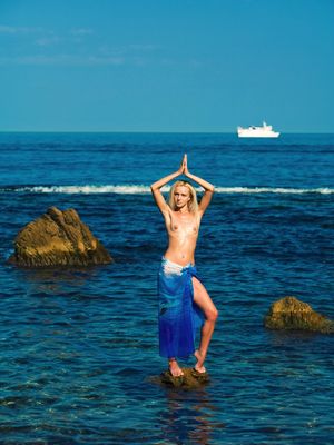 Love Hairy - Young blonde girl Aquamarine A goes topless in the ocean amid rocks