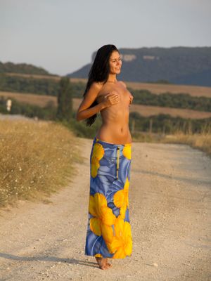 Erotic Beauty - Gorgeous model Macy B drops her sarong to pose on the road with tiny tits bare