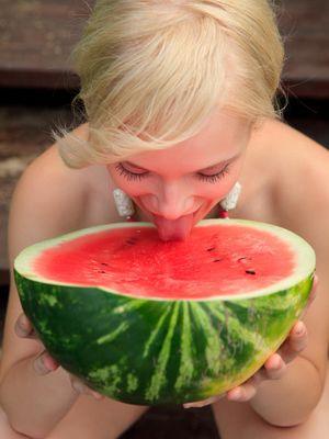 Rylsky Art - Beautiful blonde Feeona eats a watermelon while posing naked on lakeside dock