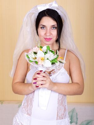 AllOver30 - 30 plus bride Tanita sticks her flower arrangement in her trimmed muff